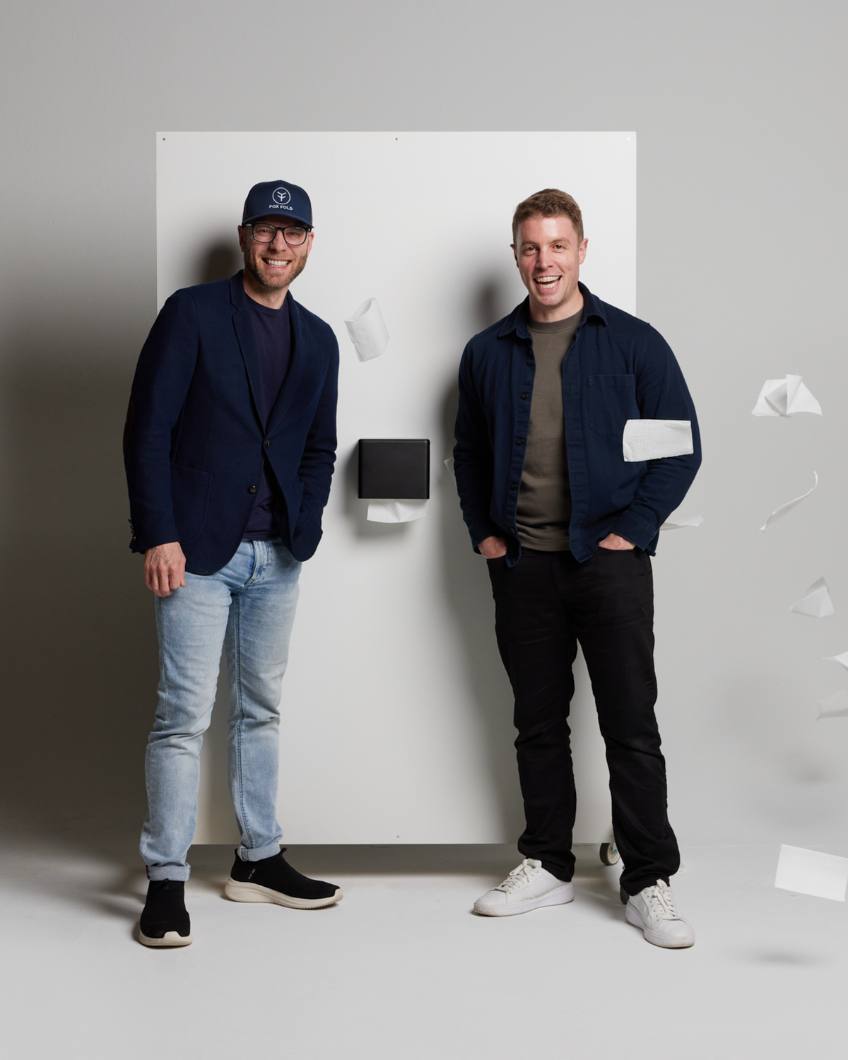 Ludo & Greg with the patent-pending refillable toilet paper dispenser.