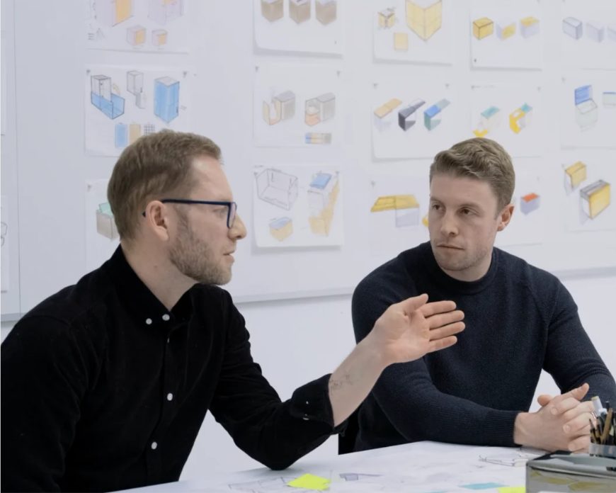 The Fox Fold team reviewing dispenser design sketches